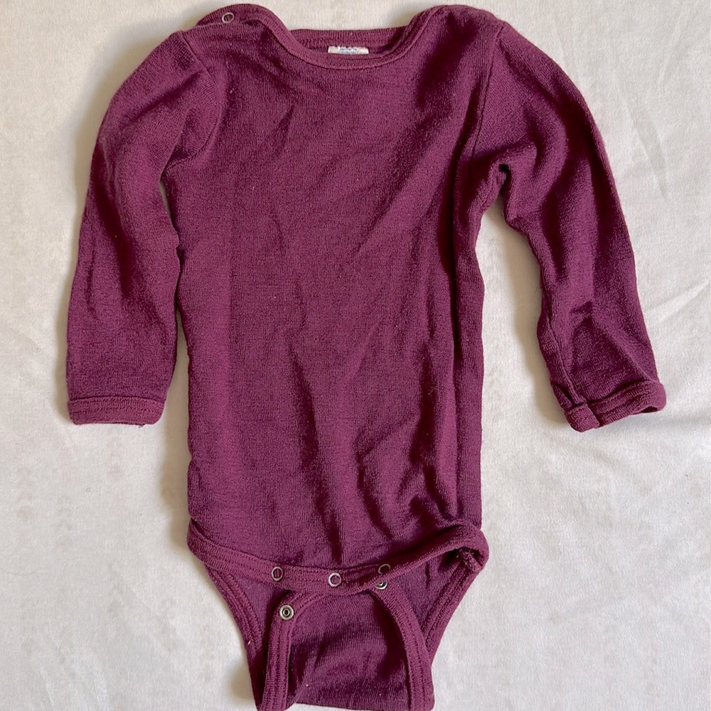 Engel Merino Wool baby onesie in a bright cranberry color, size 74/80